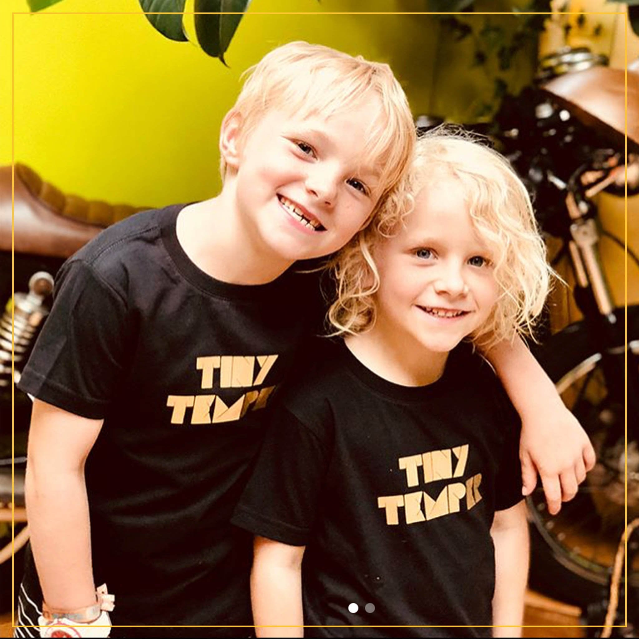 boy and girl in black novelty tees with 'tiny temper' print